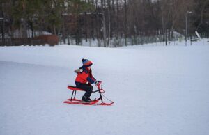 Winter Activities For Children-a-kid-playing-in-the-snow